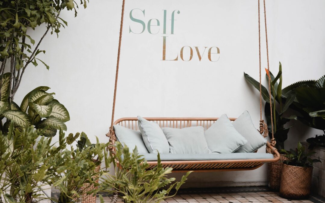 brown rattan swing bench with cushions - header for self compassion quotes